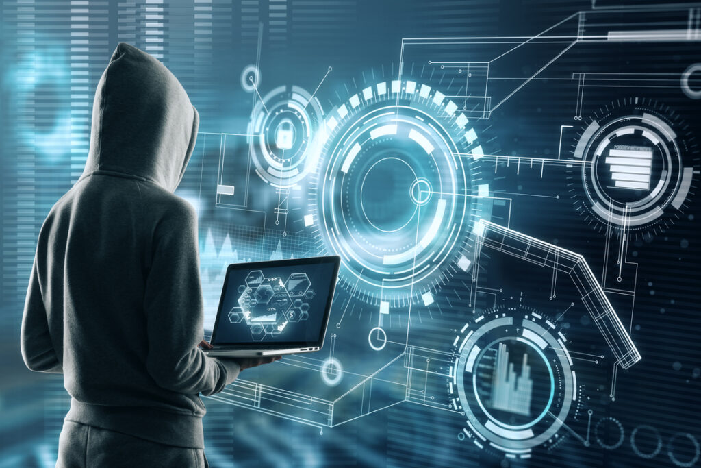 Hooded hacker holding a laptop surrounded by digital overlays, illustrating AI security risks from AI-powered phishing and generative AI security risks